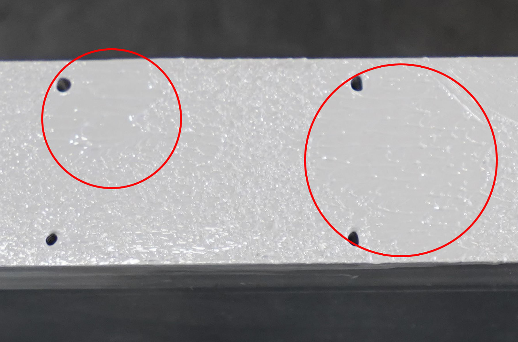 Fig 17. Roller application of thermal paste to an SL series heatsink. Circled areas show thicker layers.